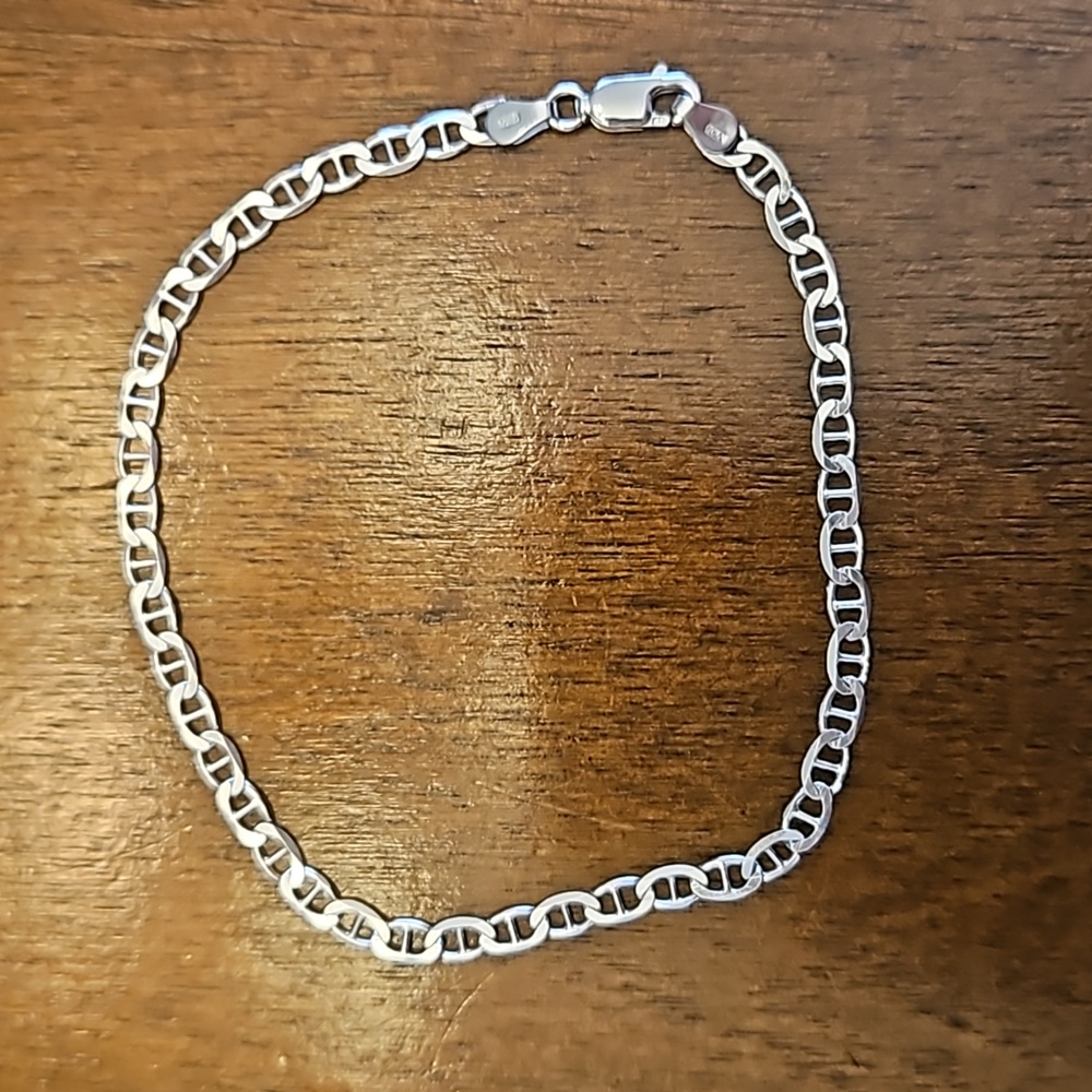 Three silver-toned bracelets - at least one is sterling silver - Picture 2 of 5